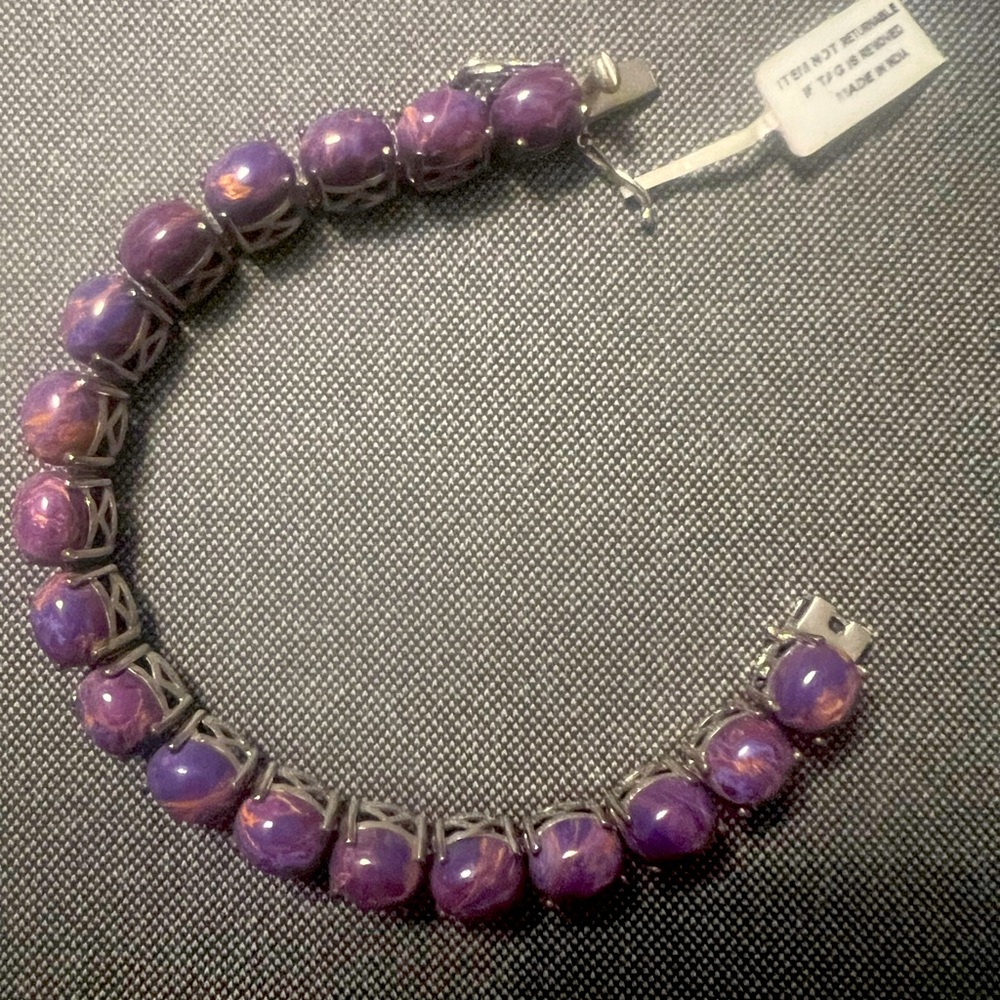 Ladies amethyst and gold bracelet set in silver 
8in